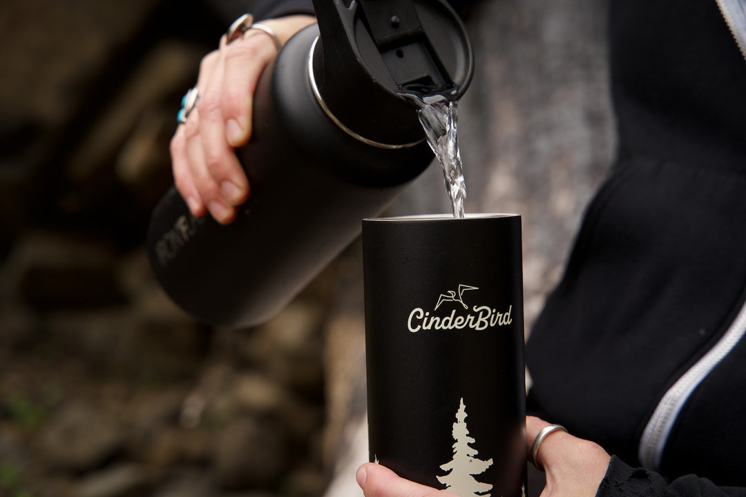Pouring hot water into a CinderBird travel thermos